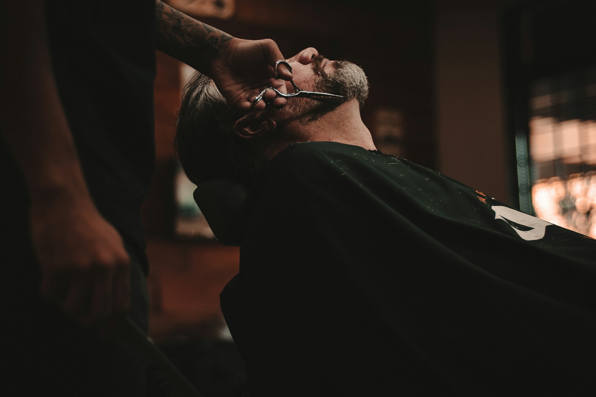Professional barber working at Salon X luxury men's grooming salon in Lahore